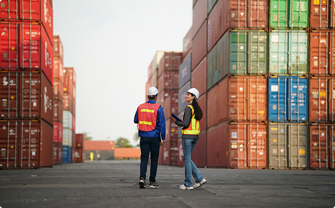 workers-discuss-logistics-in-a-busy-shipping-conta-2025-08-27-10-39-26-utc